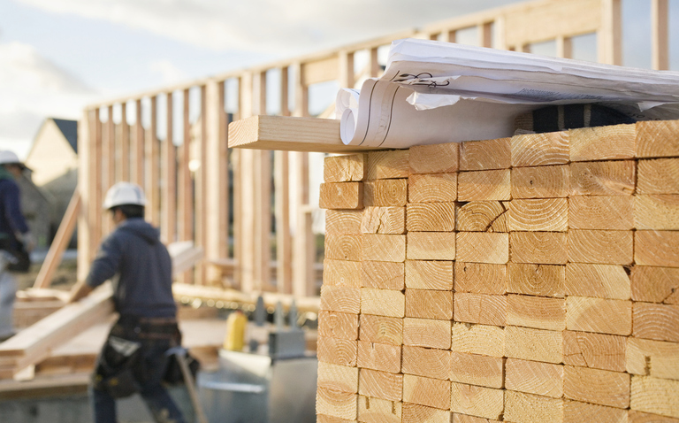 Blueprints on Lumbar in a Construction Site